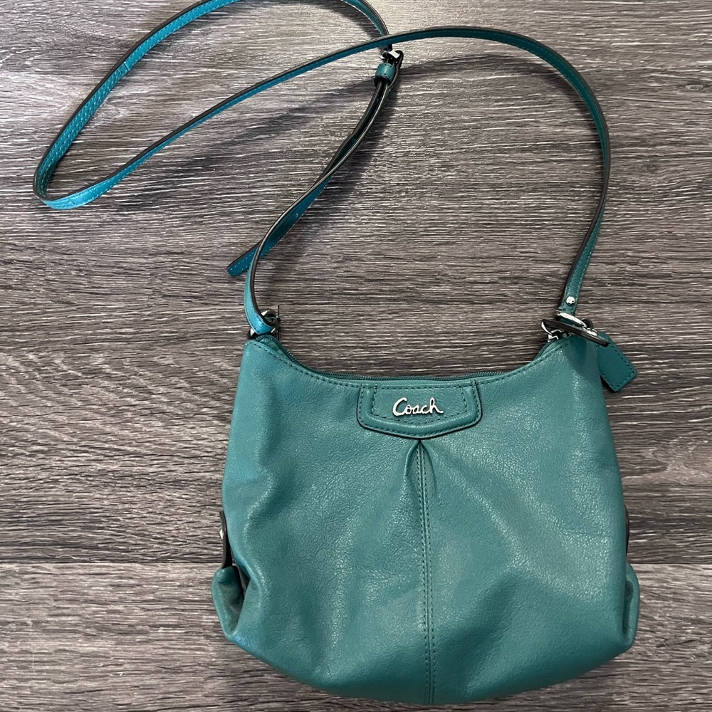 Coach Women’s leather cross body purse